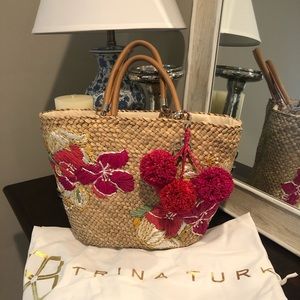 Trina Turk beach bag with pink poms